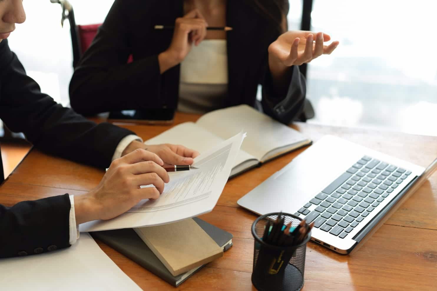 midsection man using mobile phone while sitting table riot